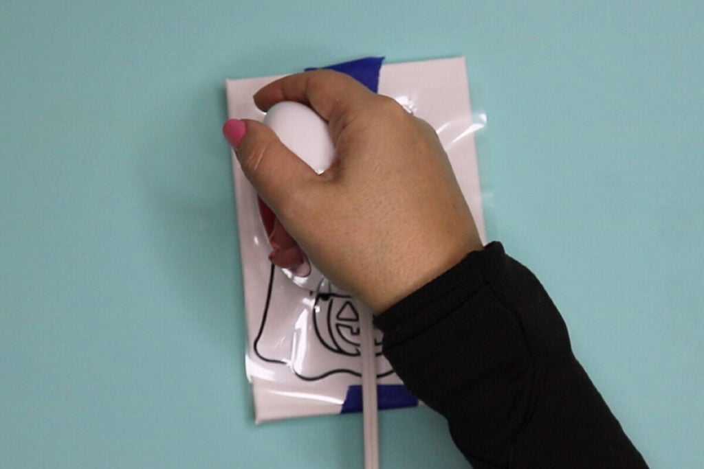 Apply the Vinyl to the Canvas with a heat press
