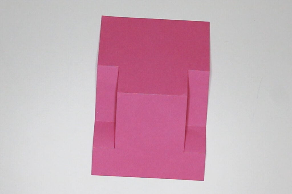 Fold the card on all the score lines