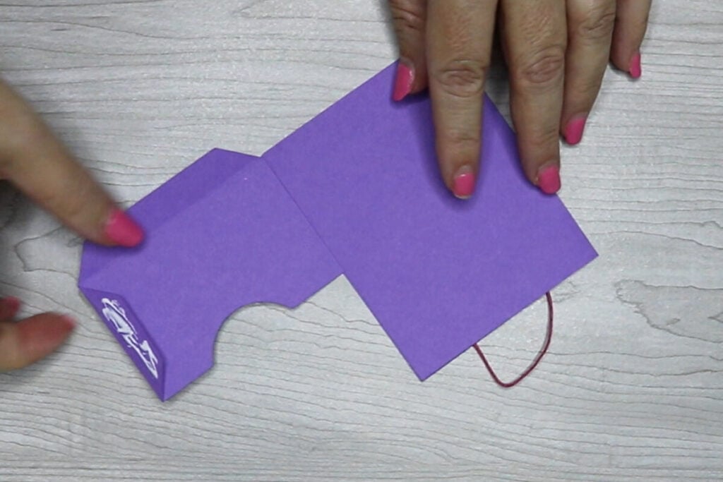 Glue the side tab piece on to the inside.