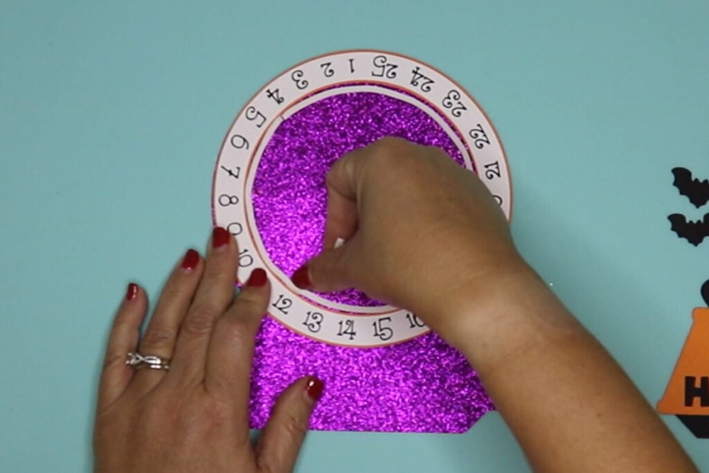 line the inside of the clock with the adhesive foam